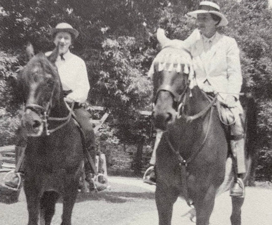 Marguerite Henry riding her Morgan horse in Wayne, Illinois with a friend